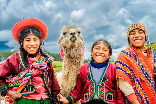 Image of three smiling Peruvian children