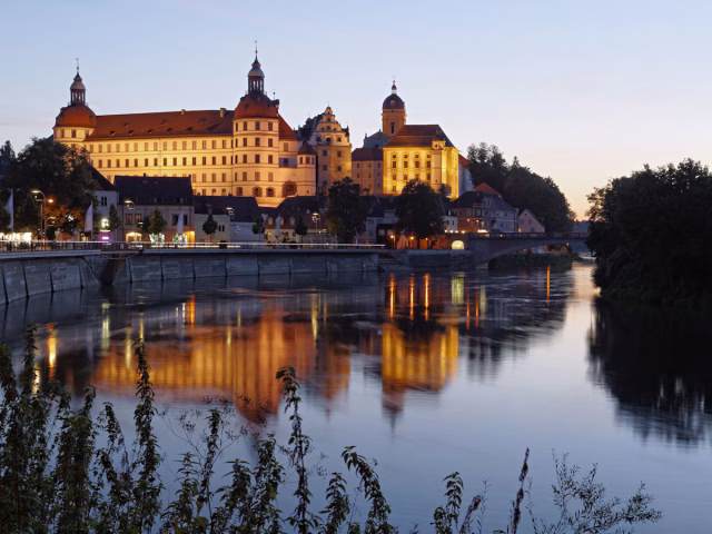 Image of a castle located above the River Danube