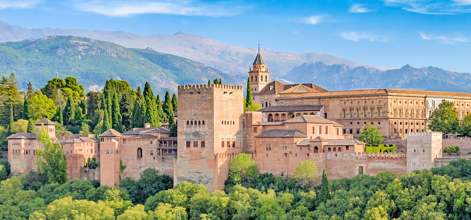 Image of the Alhambra in Grenada, Spain set against the background of the Sierra Nevada mountains