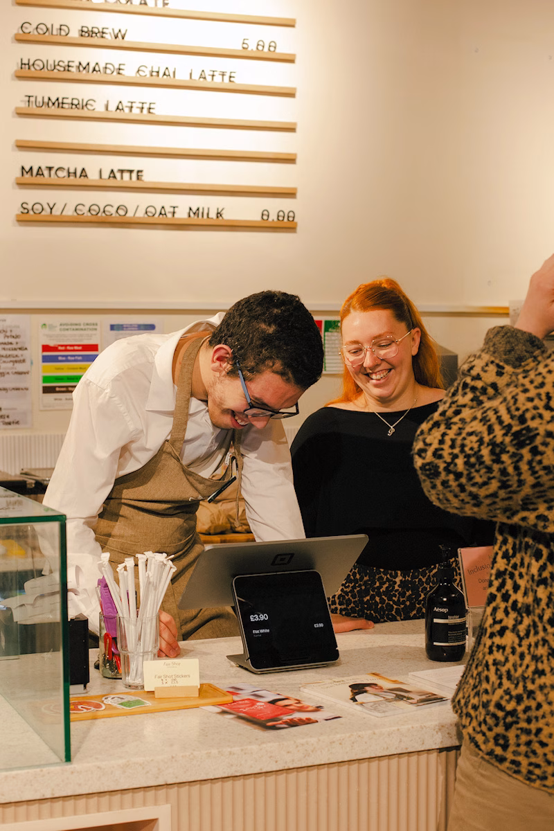 Image of a Fair Shot learner serving a customer