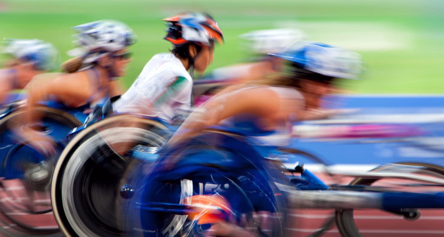 Blurred image of racing wheelchair athletes