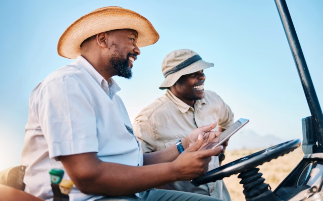 Image of two smiling safari guides