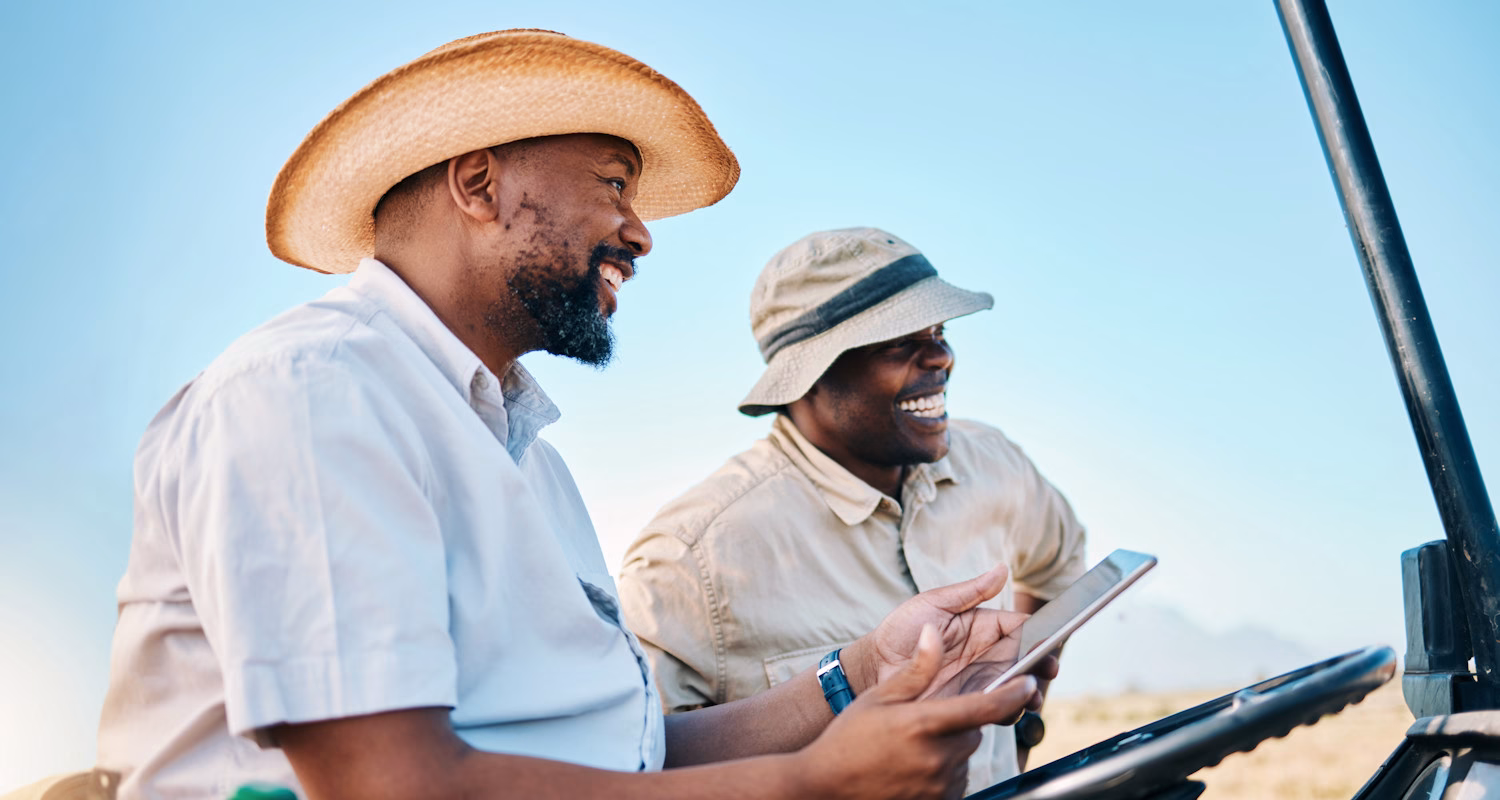 Image of two smiling safari guides