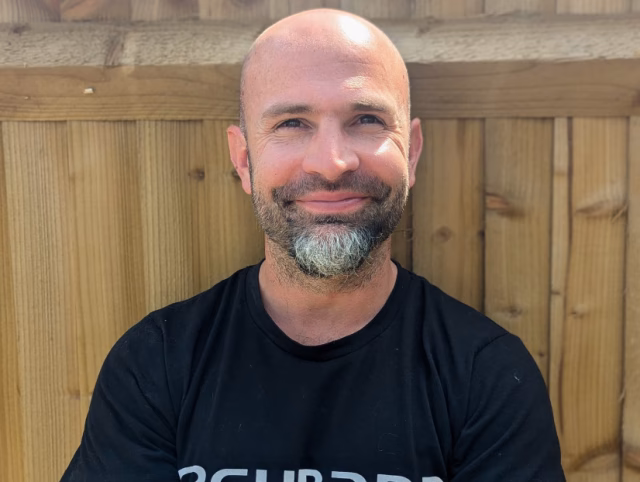 Image of a smiling Chris Fair