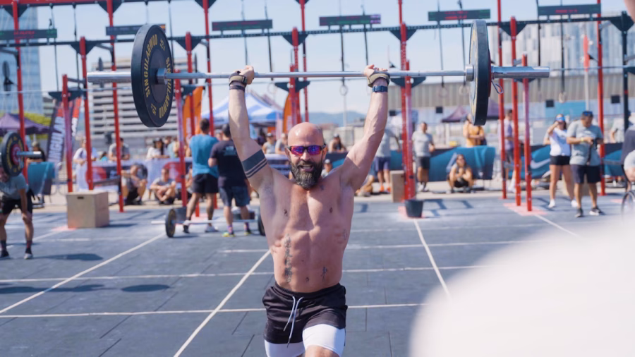 Chris Fair lifting weights in an Iron Man competition