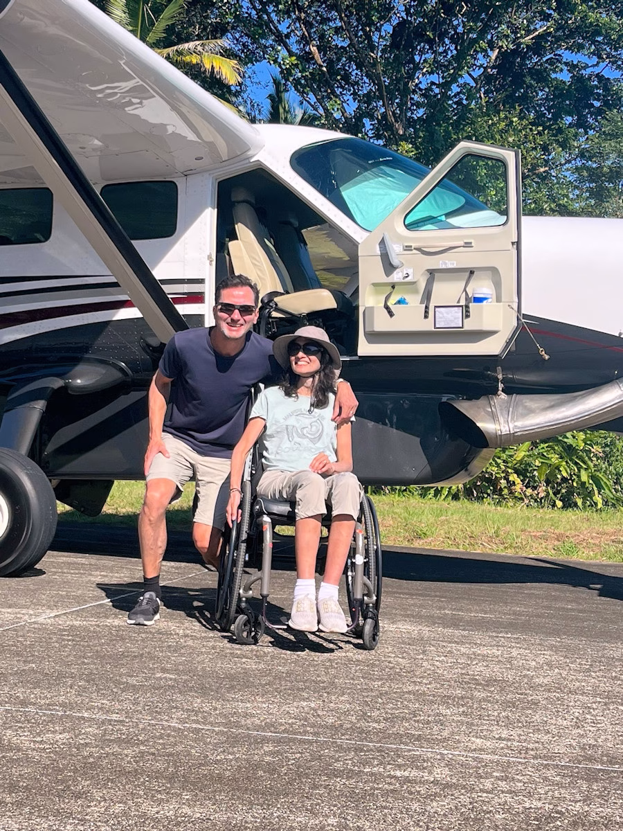 Jan pictured with Fred, pilot for Boena, outside one of their planes