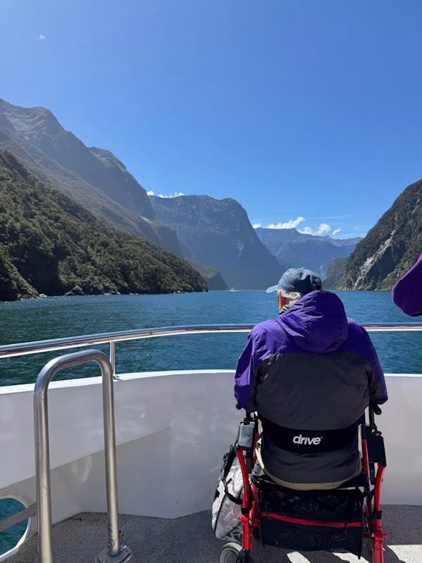 Image of a wheelchair user enjoying a cruise tour of the fiords