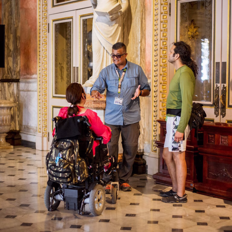 Image of an Il Viaggio guest, who is a wheelchair user, enjoying a city tour of San Jose.