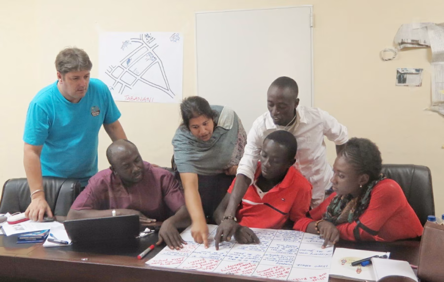 Jayni Gudka discussing plans with colleagues.