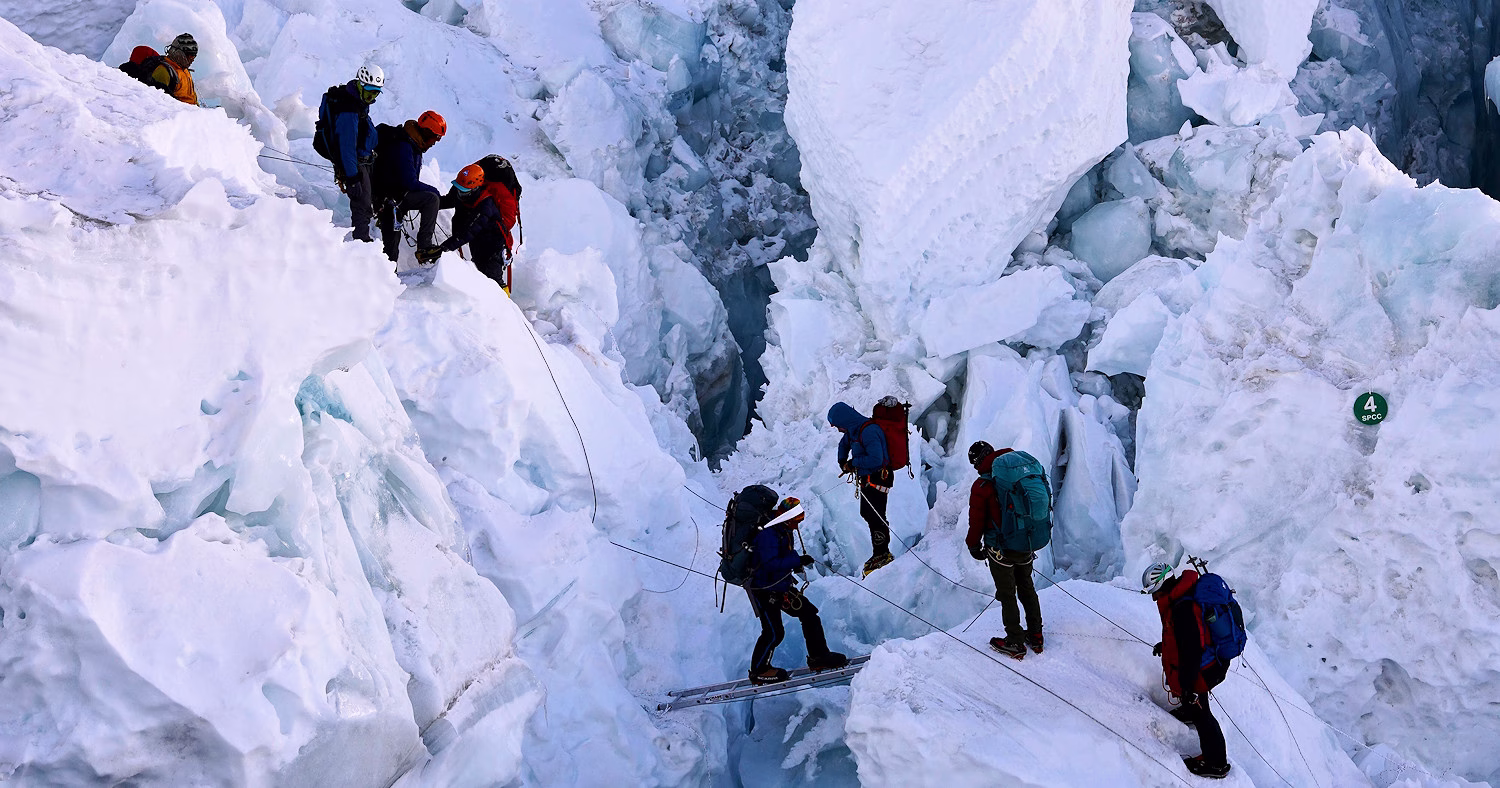 Image shows climbers on the Kumbu Icefall