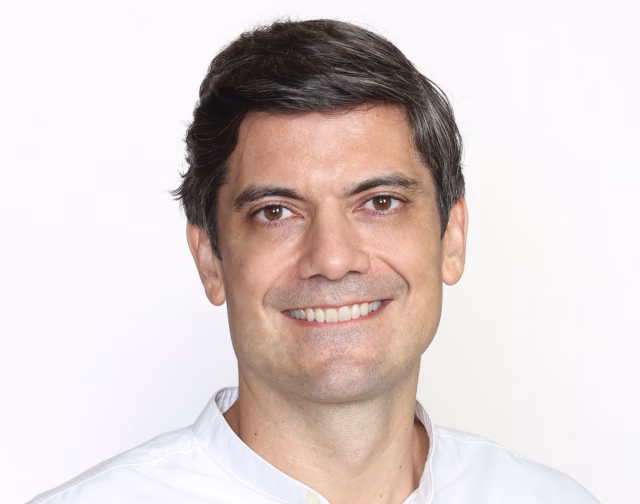 Image shows a smiling Juan Paredes
