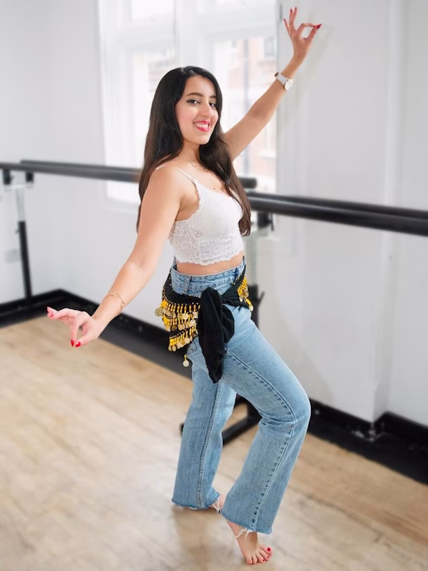 Image shows Amal Ishtar dancing in her studio