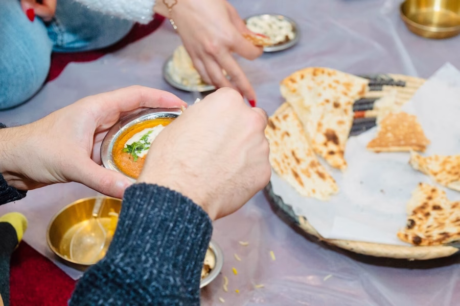 Image shows people sharing Saudi food