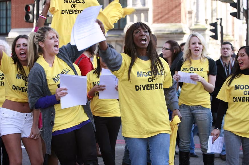 Angel Sinclair and Models of Diversity are sen protesting outside London Fashion Week.