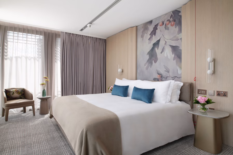 Image shows an accessible guest room at Pan Pacific London. A ceiling hoist is visible above the bed.