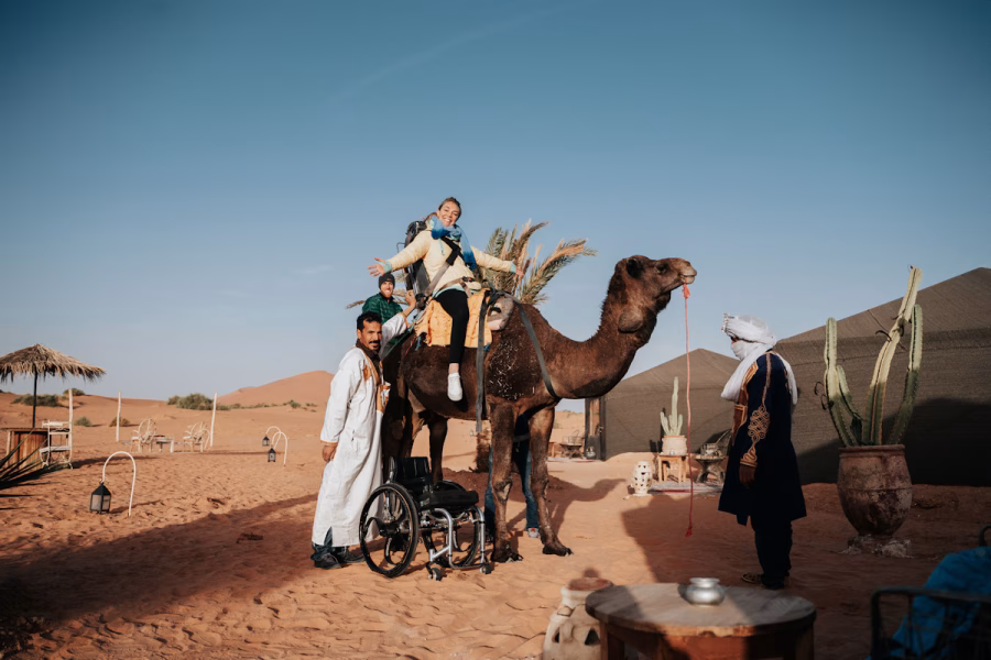 Image shows the specially designed camel saddle in use