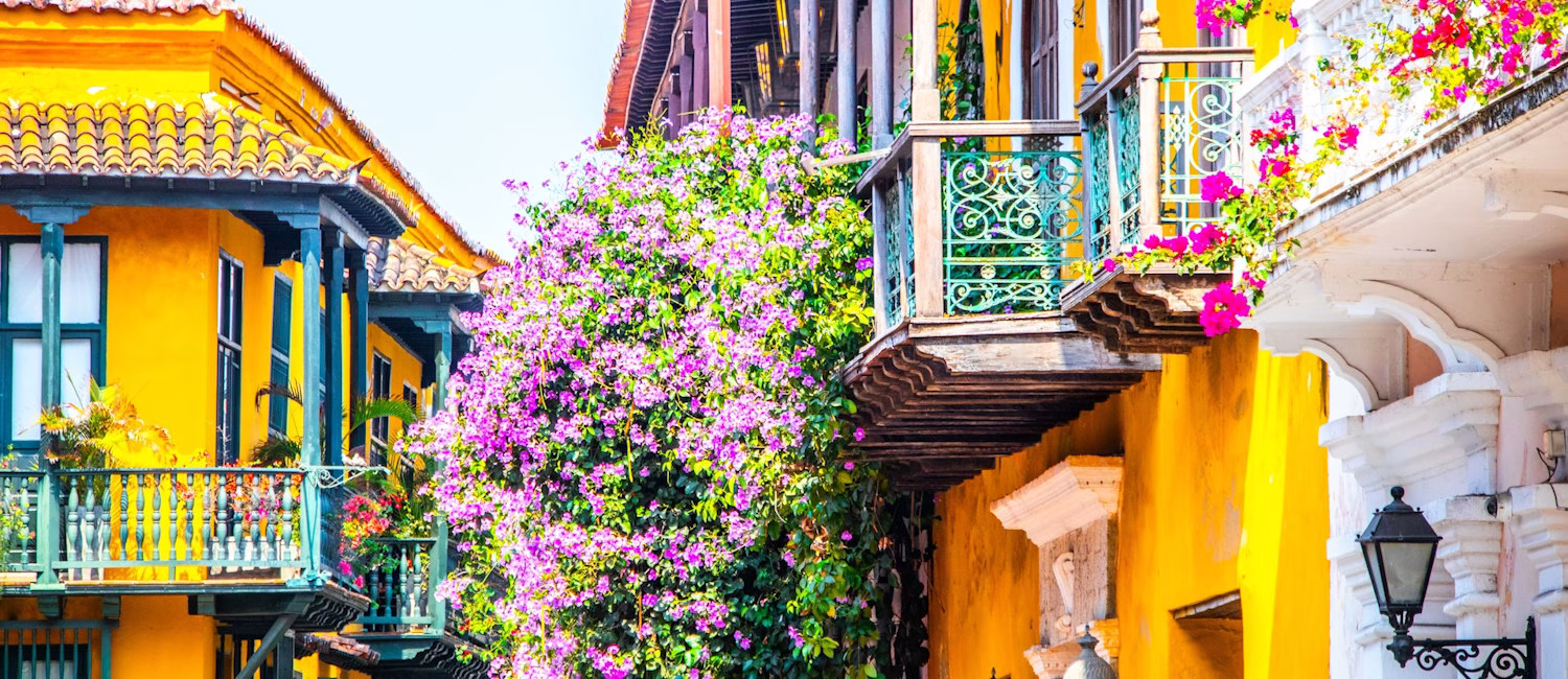 Image shows colourful house in Cartagena, Colombia